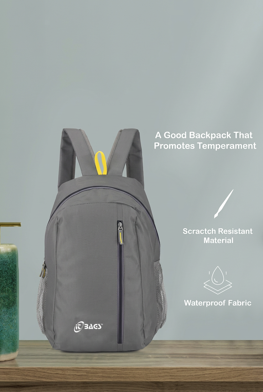 Grey backpack with yellow loop and front vertical zip beside original supplier promotional text