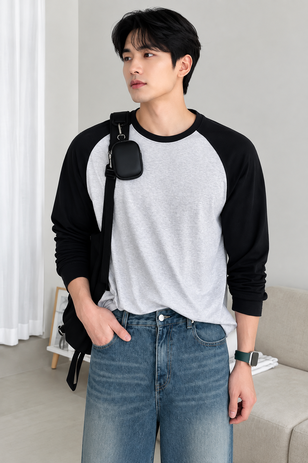 HD front view of grey and black raglan full sleeve t-shirt with hand in pocket