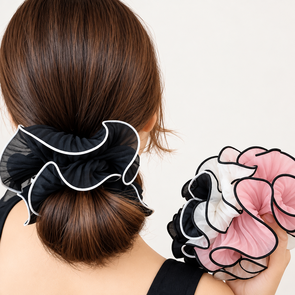 Black French style scrunchie worn on a low bun